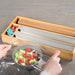 KI-generiertes Bild,4-fach Holz Folienspender Bambus Schubladen Alufolienspender Folienschneider