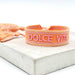 KI-generiertes Bild,Canvas Statement Armband Dolce Vita Orange Quasten besticktes Webarmband
