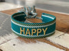 KI-generiertes Bild,Canvas Statement Armband Happy Petrol Grün Gold Quasten besticktes Webarmband