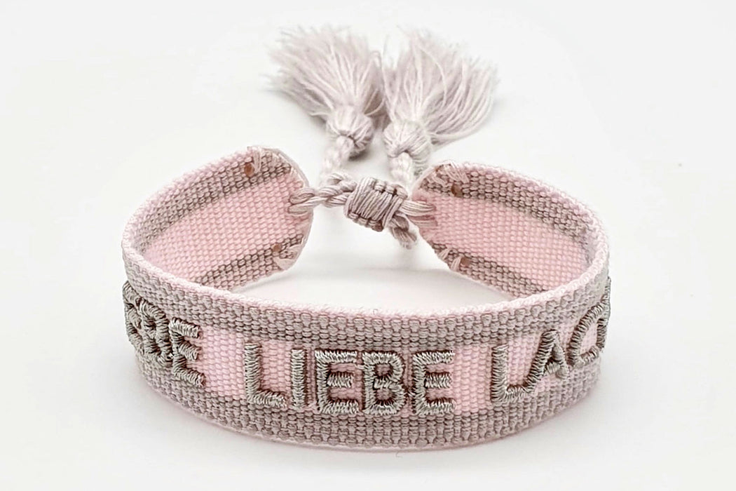 KI-generiertes Bild,Canvas Statement Armband Lebe Liebe Lache Rosa Quasten besticktes Webarmband