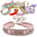 KI-generiertes Bild Canvas Statement Armband Lebe Liebe Lache Rosa Quasten besticktes Webarmband