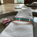 KI-generiertes Bild,Canvas Statement Armband Love Peace Happiness Quasten besticktes Webarmband