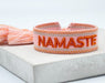 KI-generiertes Bild,Canvas Statement Armband Namaste Rosa Orange Quasten besticktes Webarmband