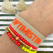 KI-generiertes Bild,Canvas Statement Armband Optimistin Beige Quasten besticktes Webarmband