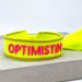 KI-generiertes Bild,Canvas Statement Armband Optimistin Neon Gelb Pink Quasten besticktes Webarmband