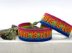 KI-generiertes Bild,Canvas Statement Armband Love is Love Regenbogen Quasten besticktes Webarmband